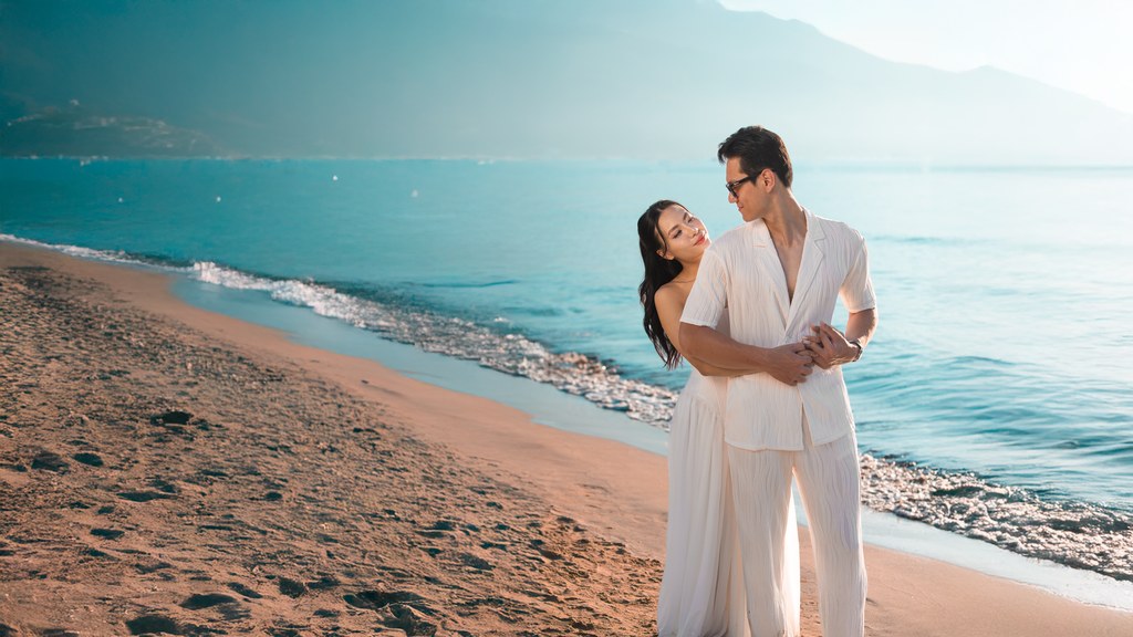 Couple embracing on a sunny beach; kindness and dependability mark a good match