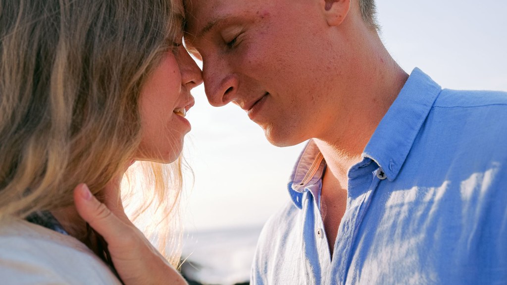Couple touching foreheads with eyes closed, a calm moment beyond worries about ejaculation time