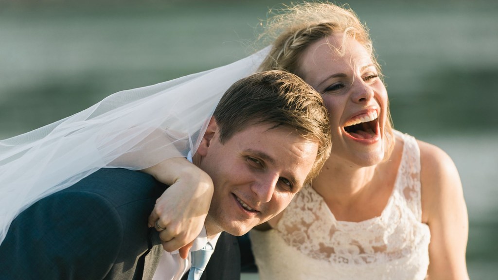 Joyful couple sharing a playful embrace outdoors, a reminder that sex after 60 can remain warm and close